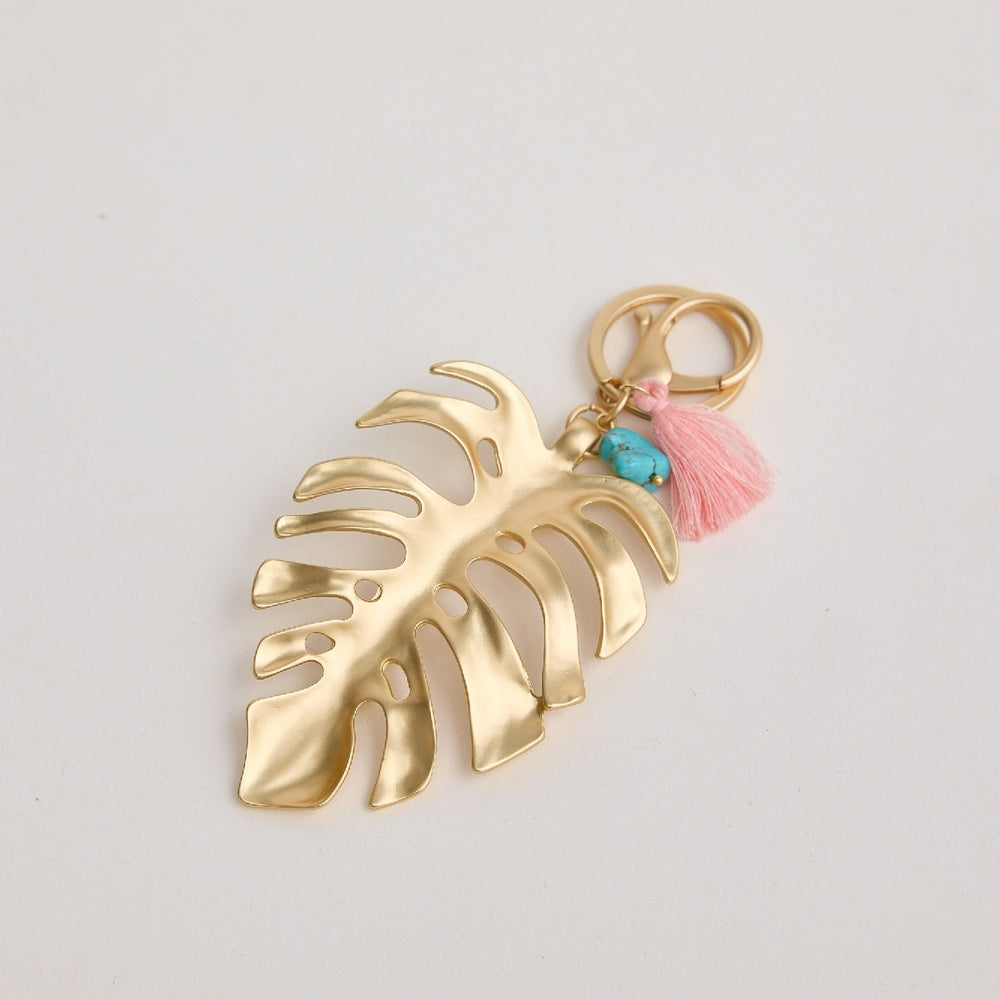 Holiday Leaf Key Ring in Brushed Gold with blue stone & tassle